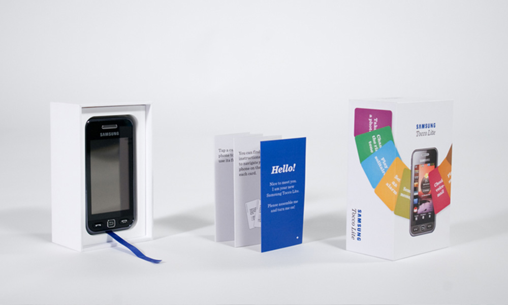 A phone box and manual are shown as a product shot